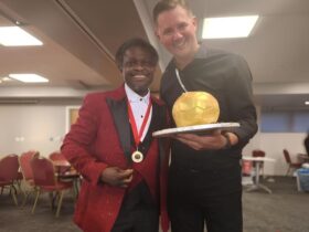 Ghanaian Scout Theophilus Nii Ankamah Densu (left) with his medal