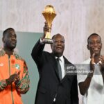 Ivory Coast coach Emerse Fae (Left), President of Ivory Coast Alassane Ouattara ( middle) and former Captain Max-Alain Grade ( right)
