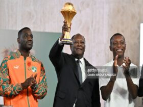 Ivory Coast coach Emerse Fae (Left), President of Ivory Coast Alassane Ouattara ( middle) and former Captain Max-Alain Grade ( right)