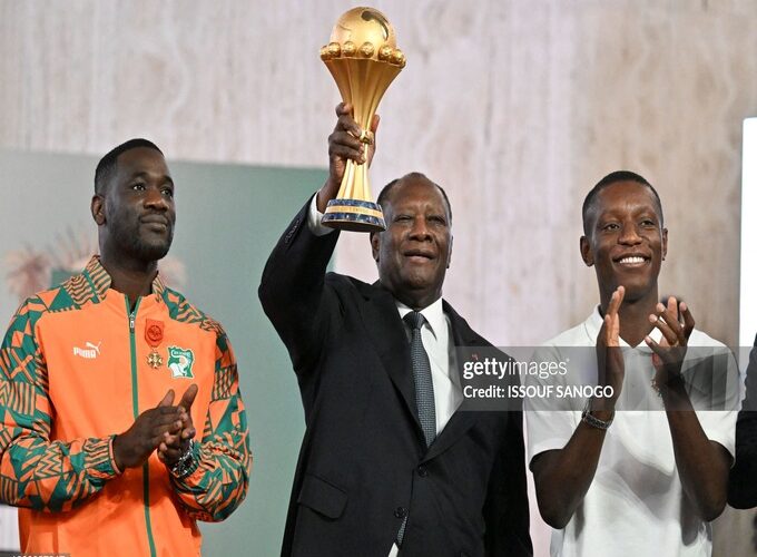 Ivory Coast coach Emerse Fae (Left), President of Ivory Coast Alassane Ouattara ( middle) and former Captain Max-Alain Grade ( right)